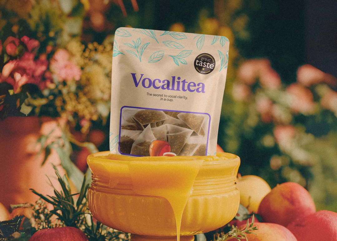 Vocalitea Caramel Apple and Honey among flowers, with honey